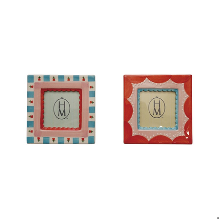 Two decorative picture frames with 'HM' logo on a white background