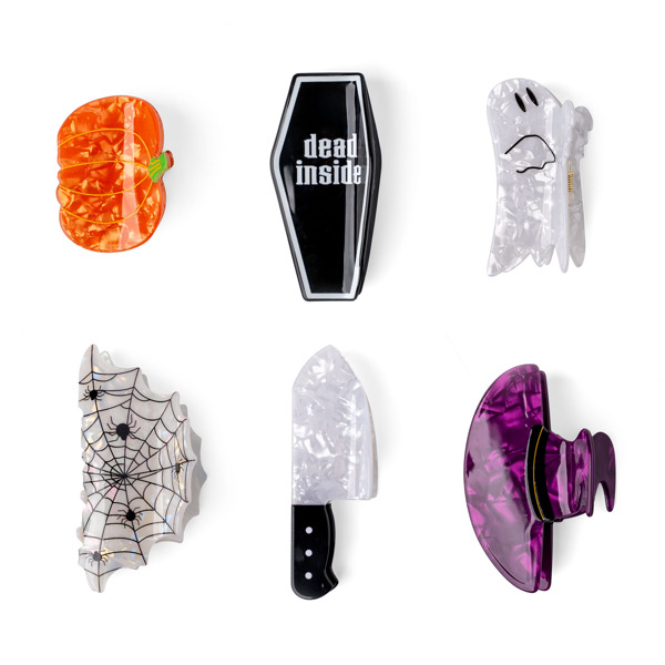 Set of Halloween-themed bottle openers on a white background