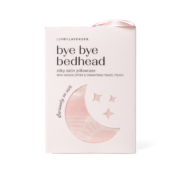 A pale pink product box for 'Bye Bye Bedhead' by Lemon Lavender, featuring a crescent moon and star design with a small window showing a silky satin pillowcase inside.