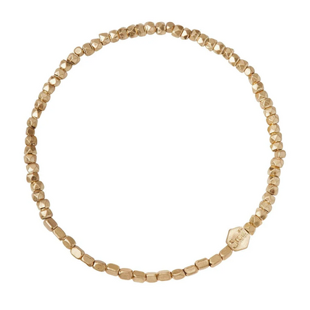 Gold beaded bracelet on a white background