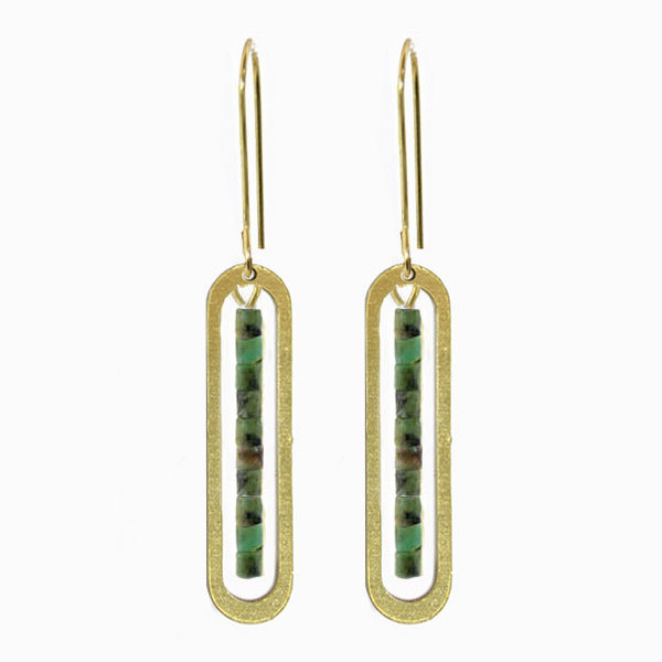 Gold earrings with green stone inlays on a white background