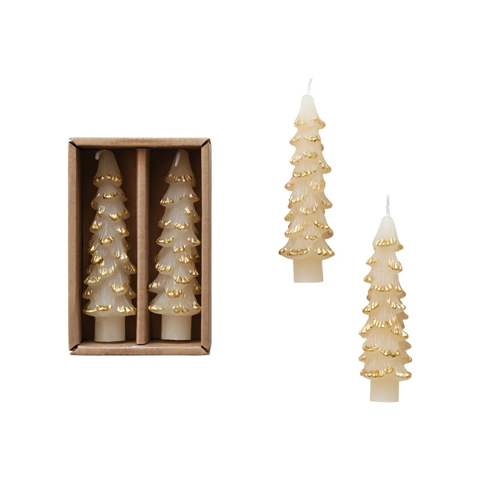 Set of tree-shaped candles with gold accents, one in a box and two on a white background.