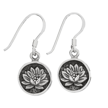 Sterling silver earrings with lotus flower imprint on a white background