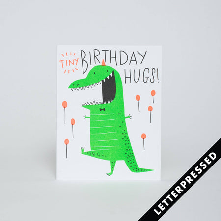Card that says "Tine Birthday Hugs!" with a green dinosaur in a party hat and tie  