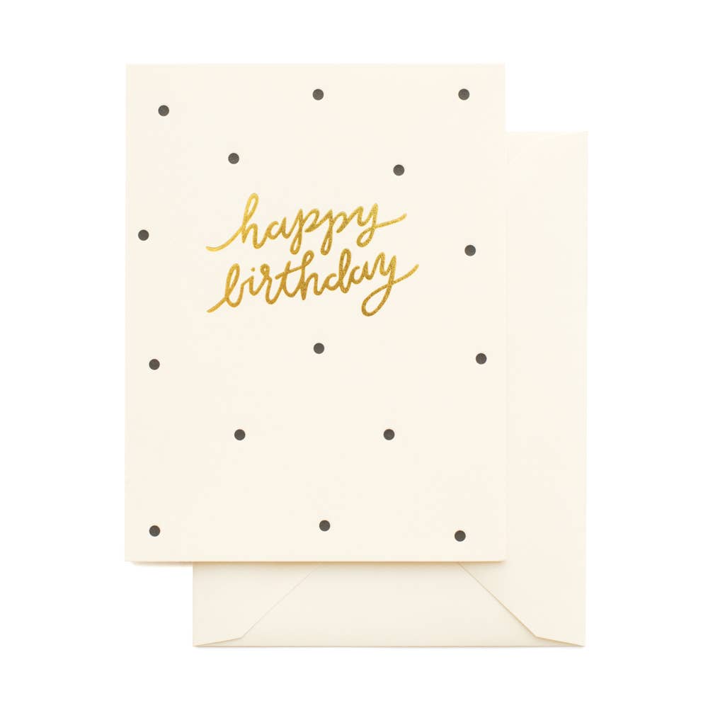 white card with black polka dots that reads " Happy Birthday" with script font in gold foil on white background