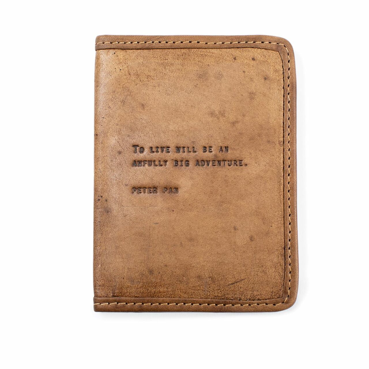 Leather passport cover with peter pan quote on a white background